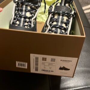 Brand new Toddler size Burberry sneakers, never been worn before. Navy blue.